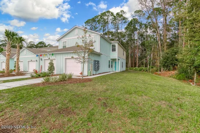 a view of backyard with tub and trees