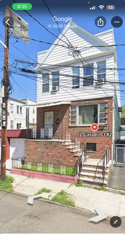 a view of a patio with table and chairs with wooden floor