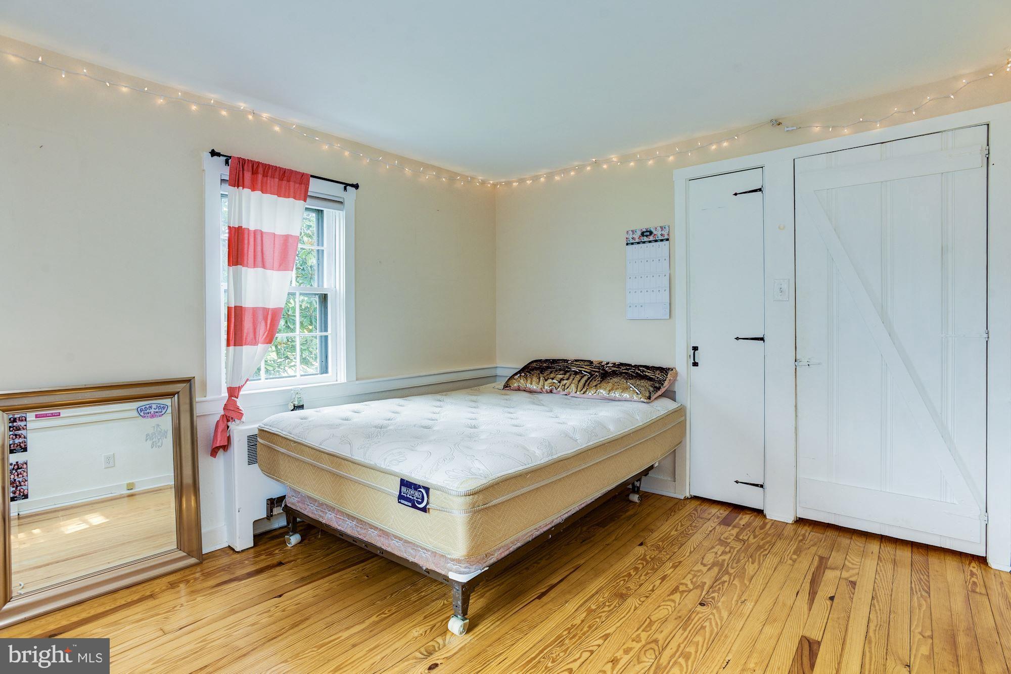 4404 Church Road Mount Laurel, NJ 08054 - Photo 17 of 22 a bedroom with a bed and wooden floor