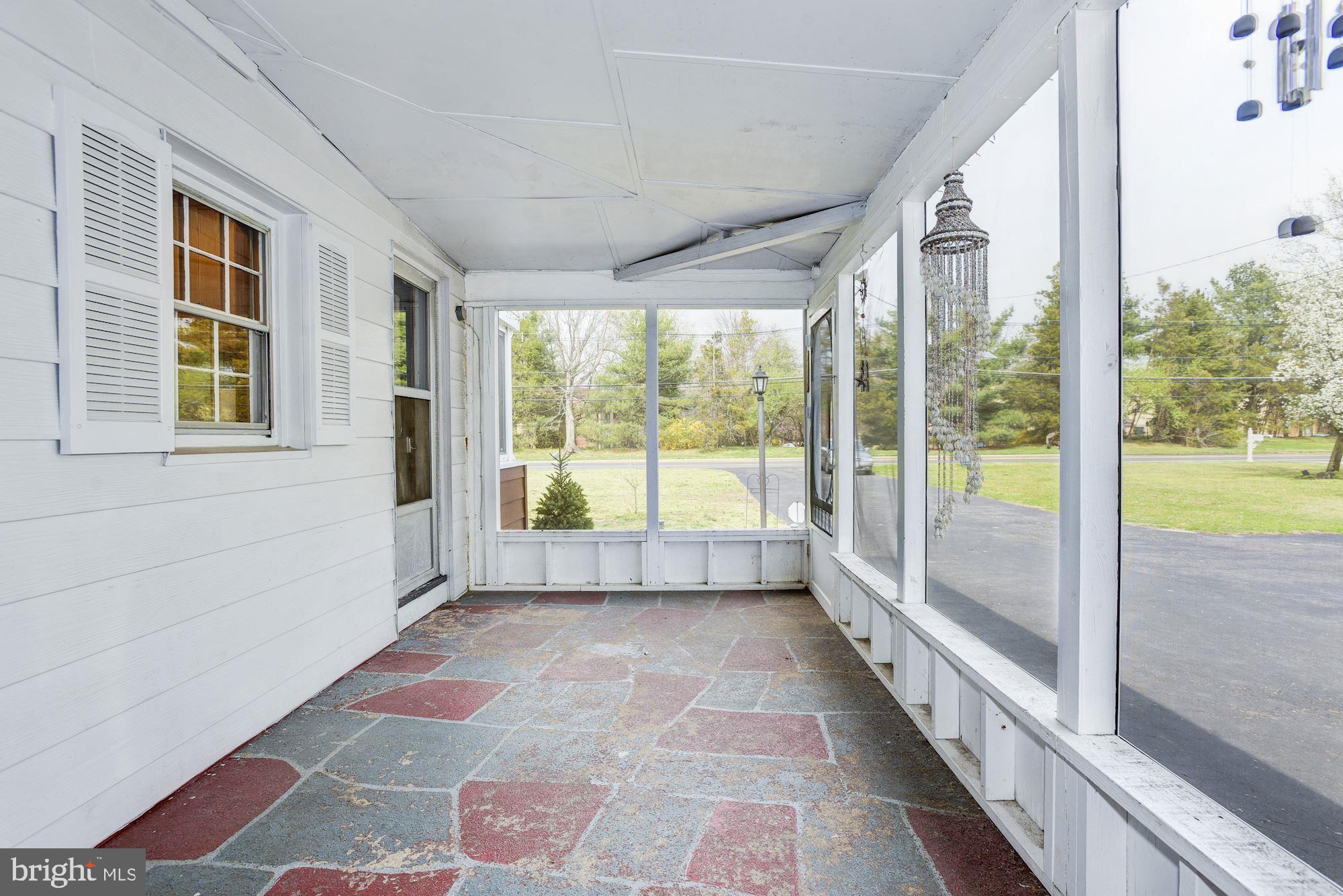4404 Church Road Mount Laurel, NJ 08054 - Photo 19 of 22 a view of hallway with a floor to ceiling window and wooden floor