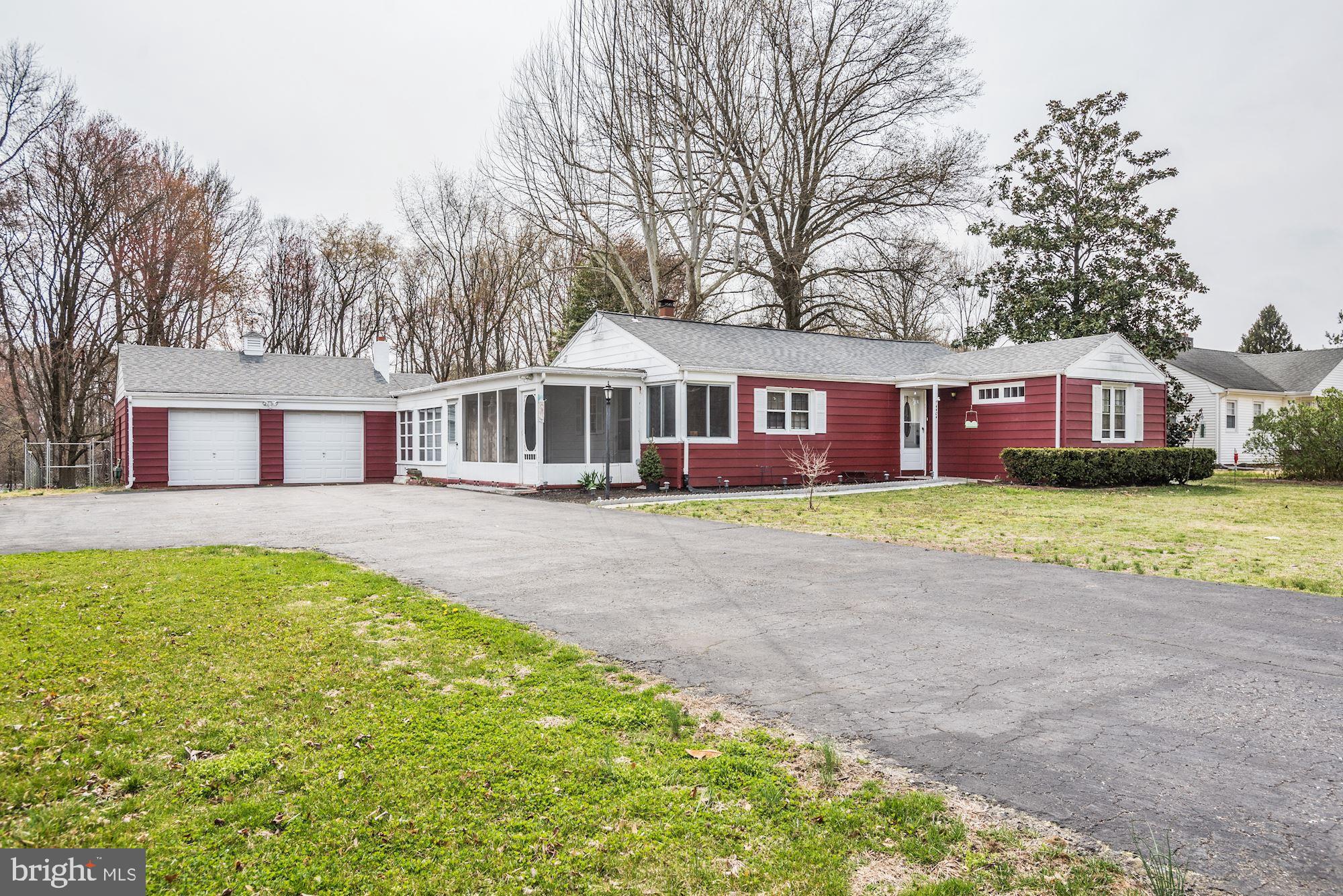 4404 Church Road Mount Laurel, NJ 08054 - Photo 21 of 22 a front view of a house with a garden and trees