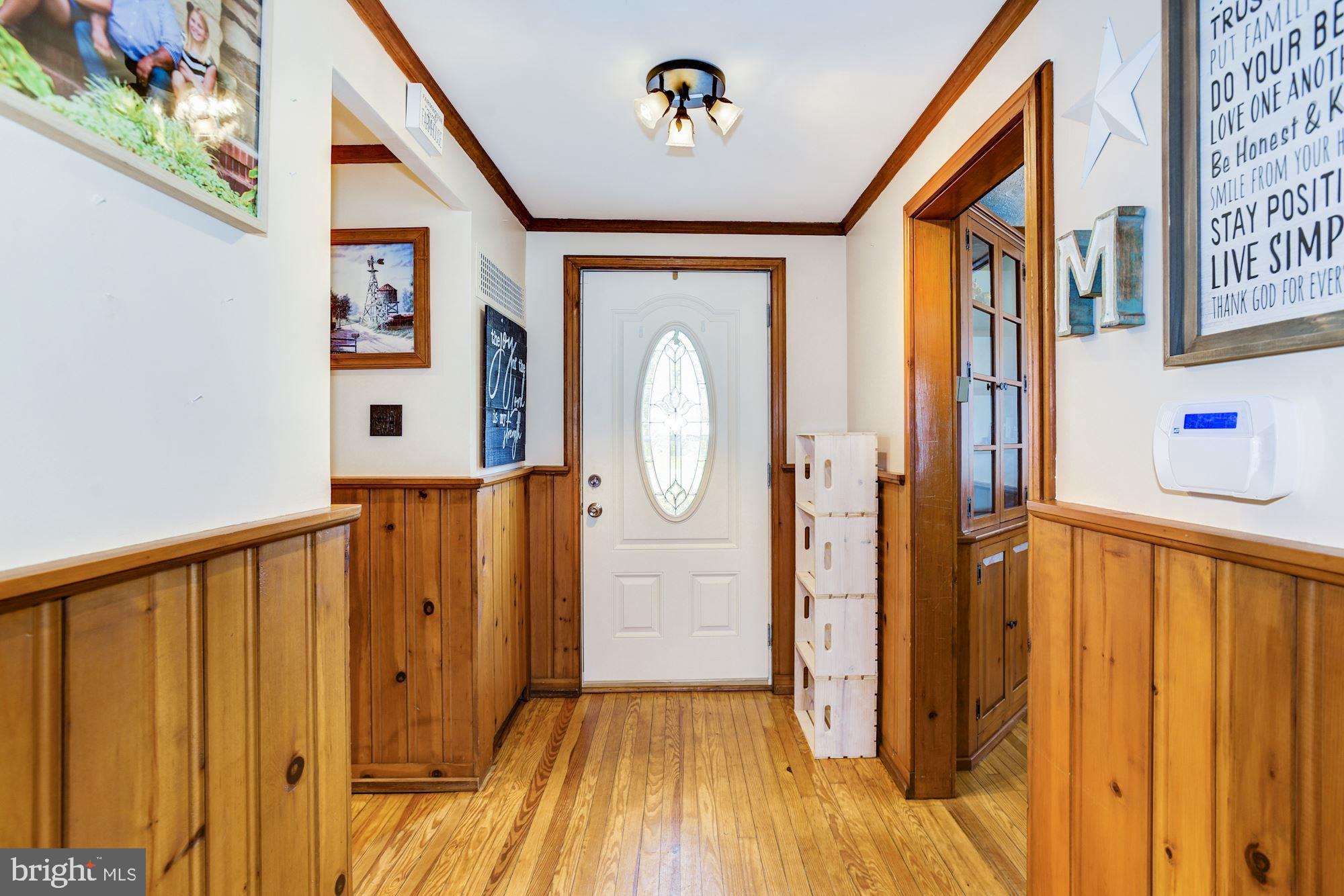 4404 Church Road Mount Laurel, NJ 08054 - Photo 4 of 22 a view of a hallway with wooden floor and staircase