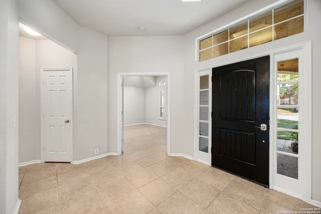 a view of an entryway with wooden floor