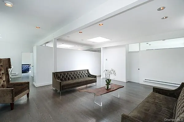 a spacious bedroom with a bed and a couch