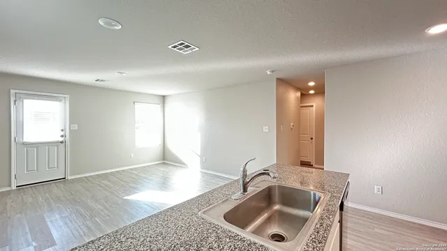 a kitchen with a sink and a window