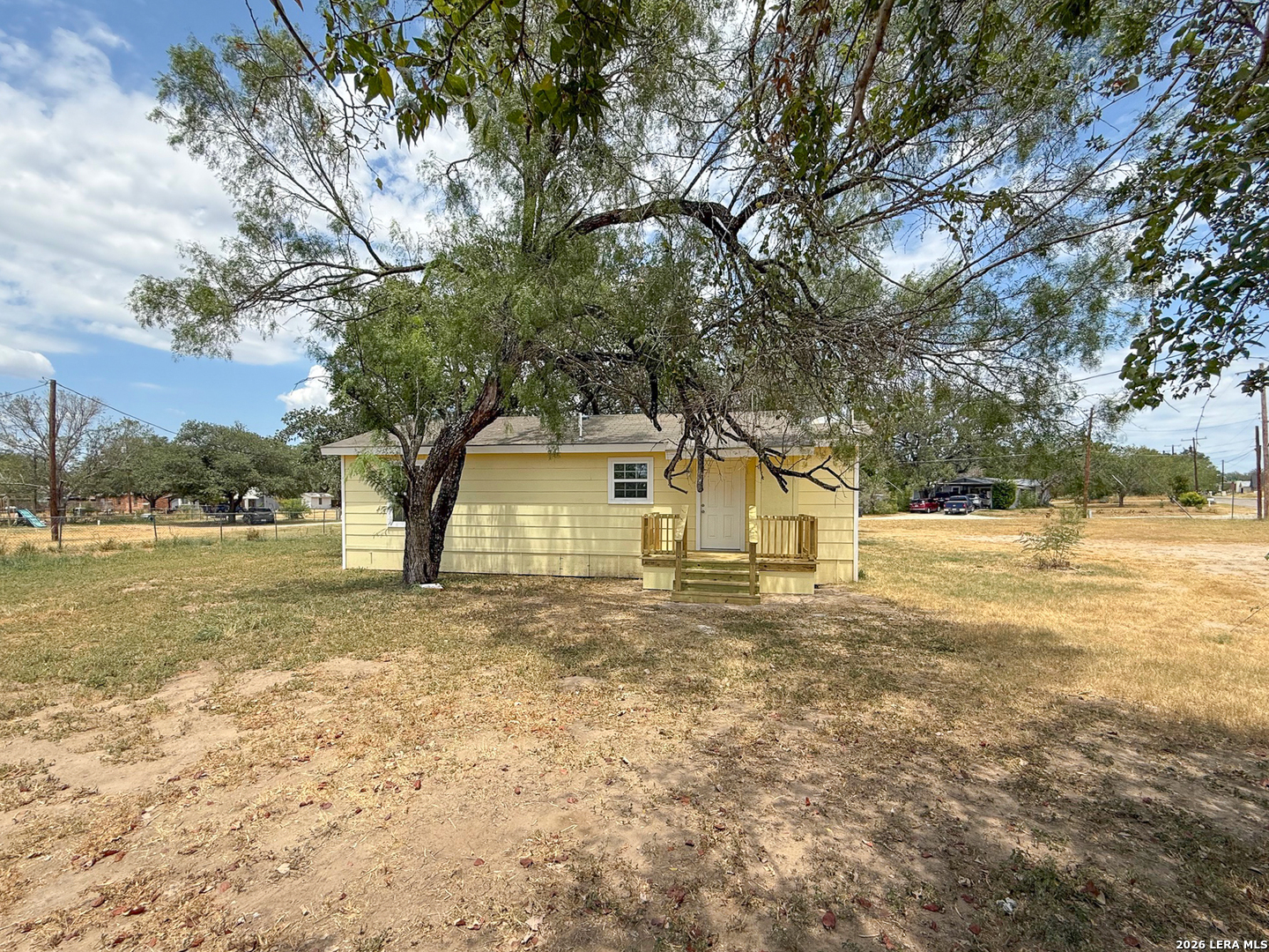 303 Davis Avenue Devine, TX 78016 - Photo 14 of 16 a view of a house with a yard