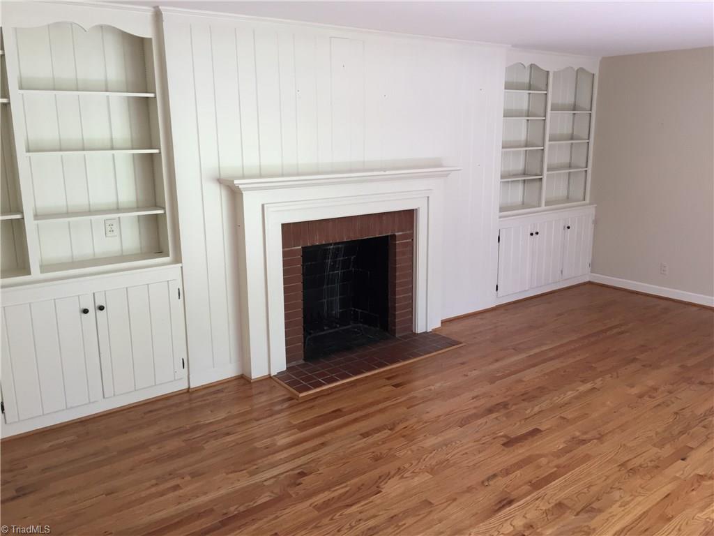 350 Robin Road Mount Airy, NC 27030 - Photo 4 of 23 Living room with built in shelves and one of three fireplaces in the house