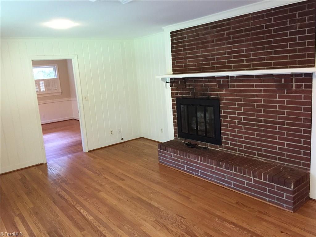 350 Robin Road Mount Airy, NC 27030 - Photo 8 of 23 Family room with fireplace leading from kitchen to den