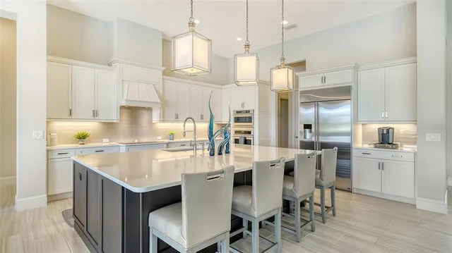 a bedroom with a balcony a bed and a flat screen tv