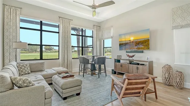 a bedroom with a bed and a lamp on the dresser