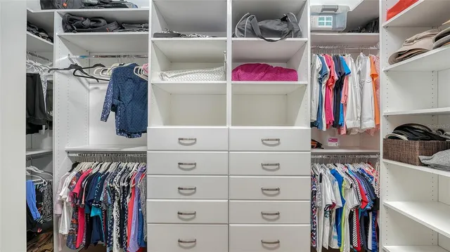 a view of a lake with houses in the back