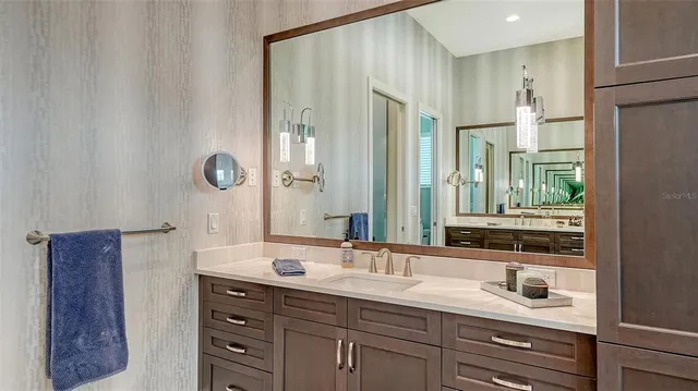 an aerial view of residential houses with outdoor space and lake view