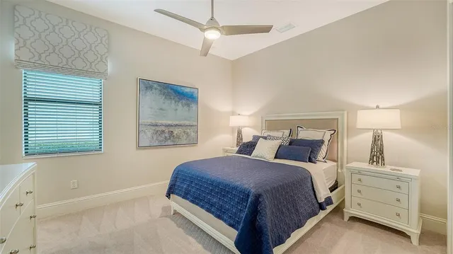 an aerial view of residential houses with outdoor space and river