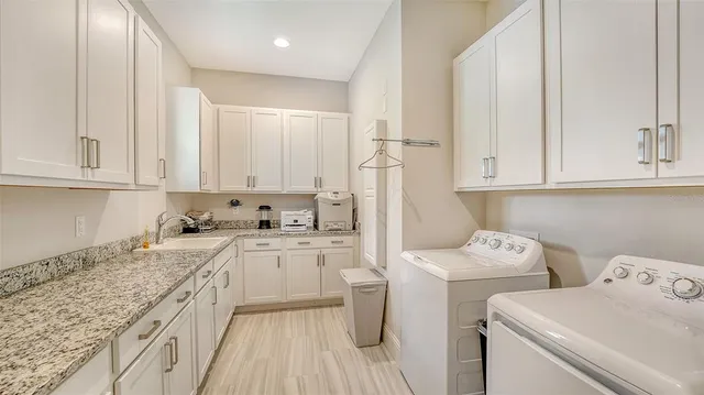 a living room with fireplace furniture flat screen tv and wooden floor