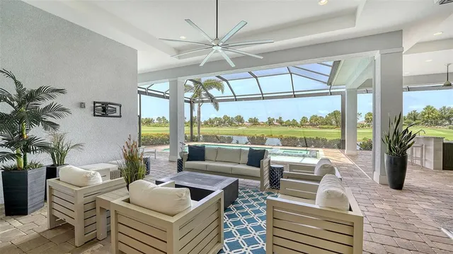 a living room with furniture fireplace and flat screen tv