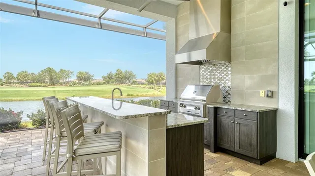 an outdoor space with pool and furniture