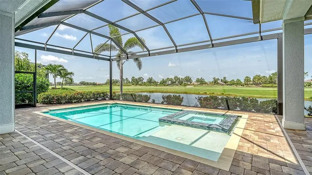 a view of a swimming pool with a patio