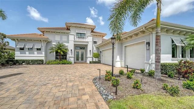 a living room with furniture wooden floor and a chandelier