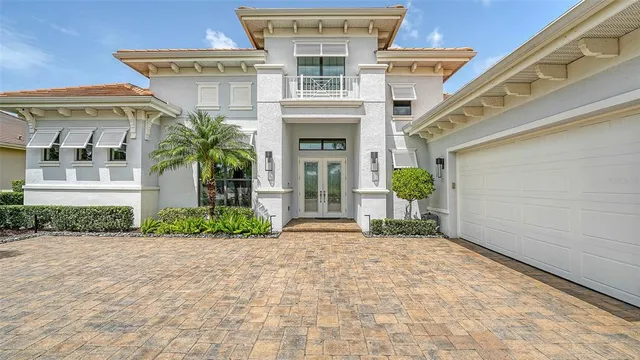 a kitchen with a sink a counter top space and living room area