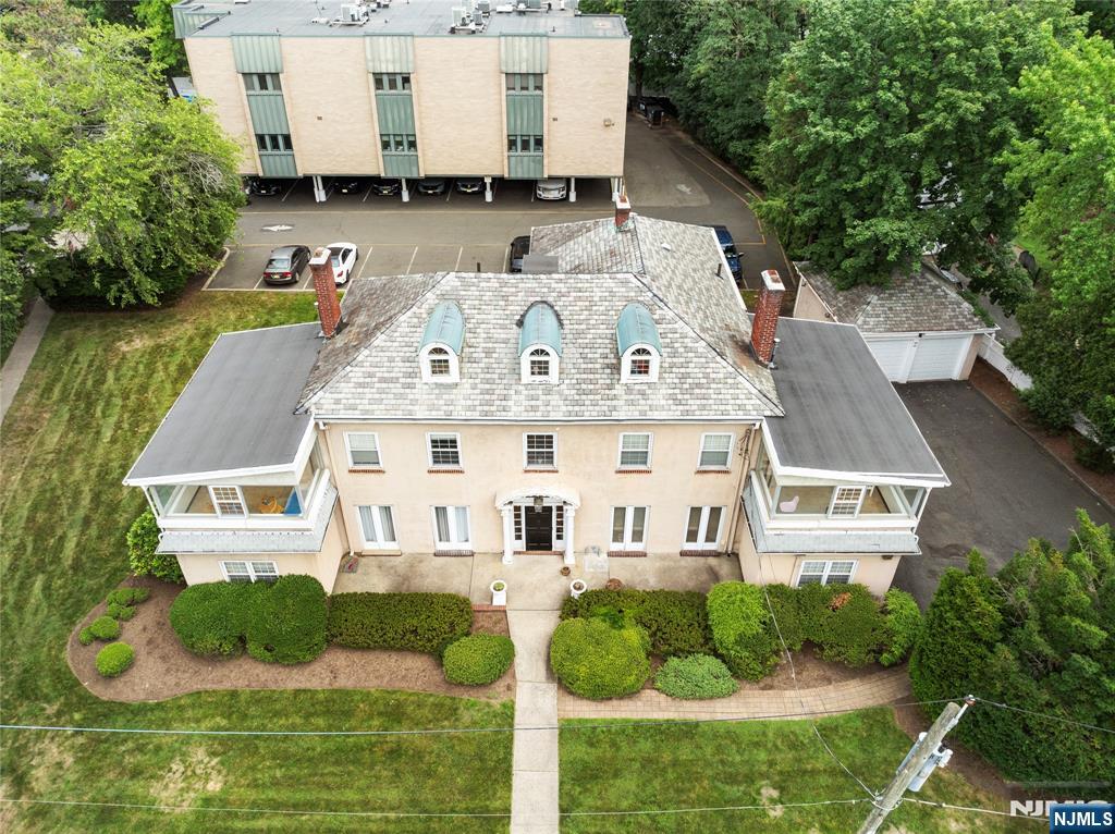 a aerial view of a house with a yard
