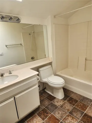 a bathroom with a toilet a sink and a bathtub