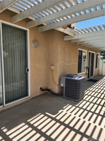 a view of a door and wooden floor