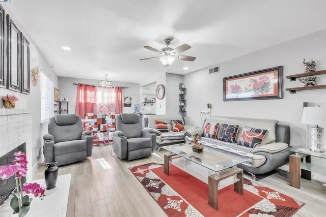 a living room with furniture and a rug