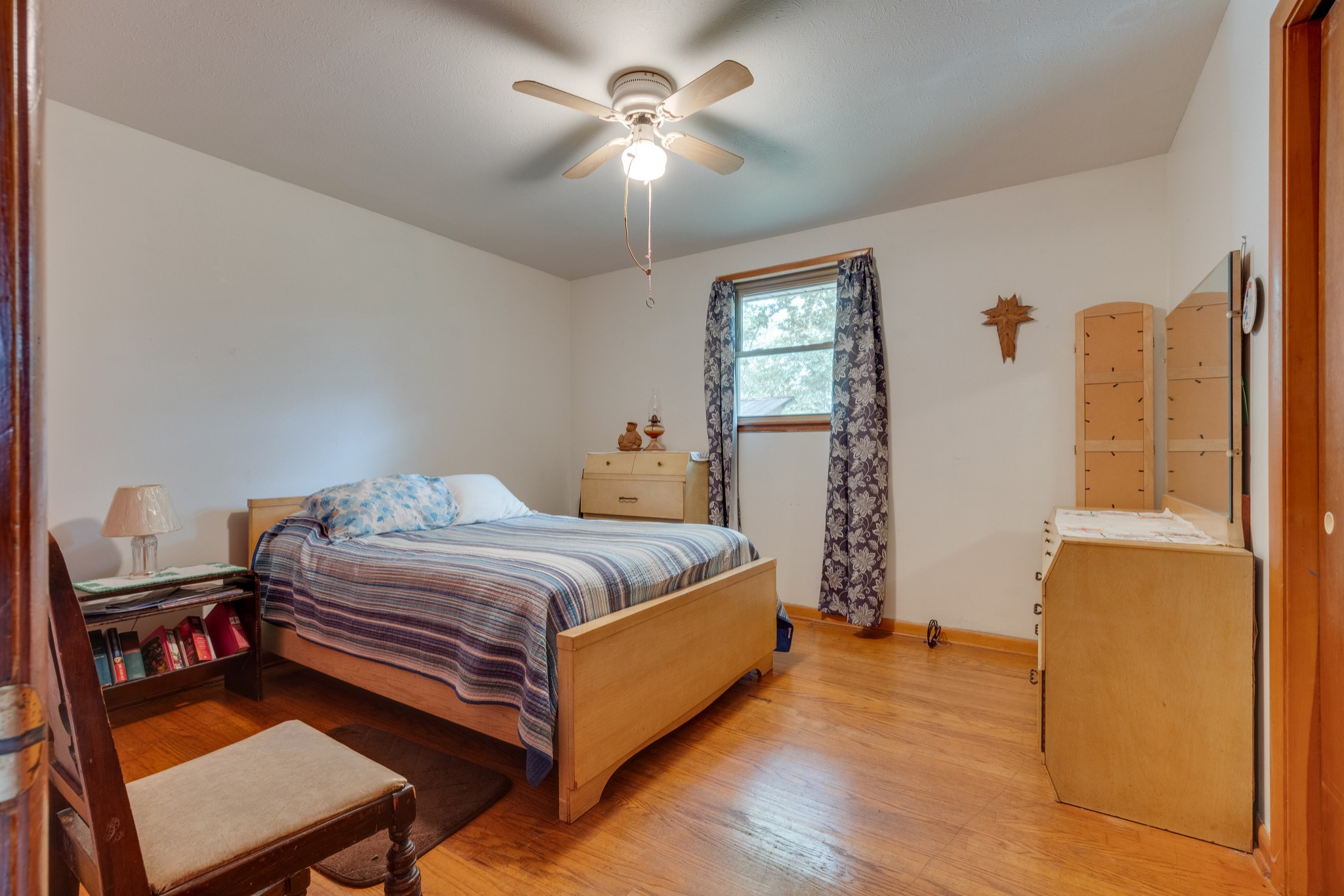 7795 Pewitt Road Franklin, TN 37064 - Photo 10 of 20 a bedroom with a bed and a chandelier
