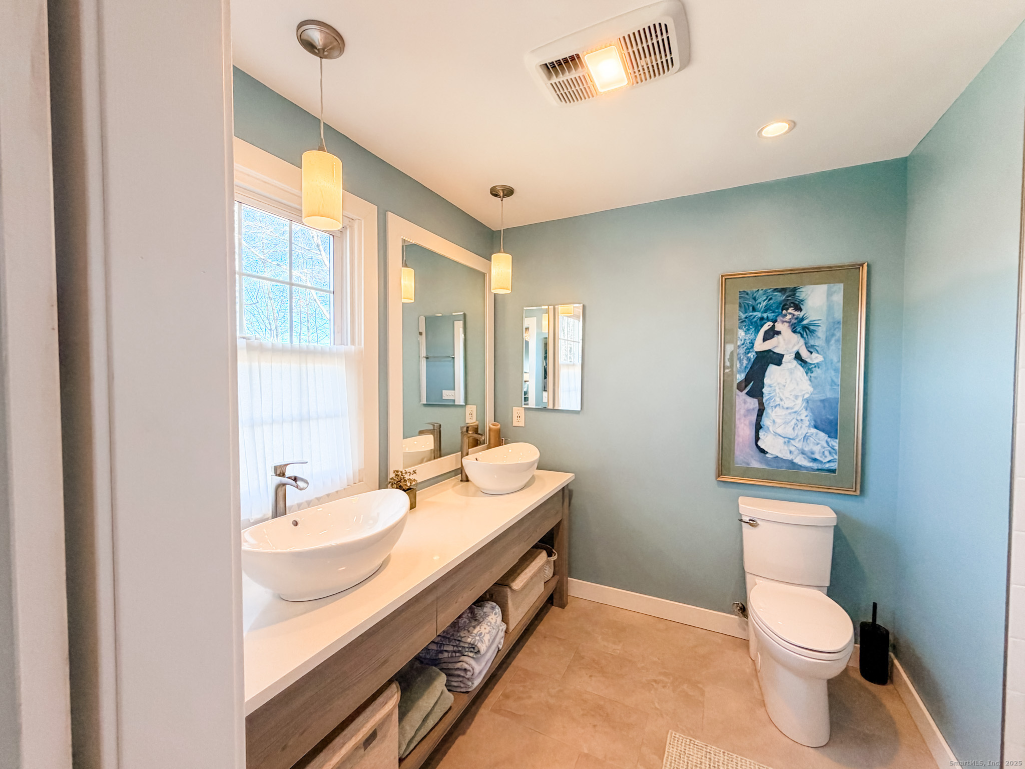 104 Pulpit Rock Road Woodstock, CT 06281 - Photo 16 of 37 a bathroom with a double vanity sink toilet and a window