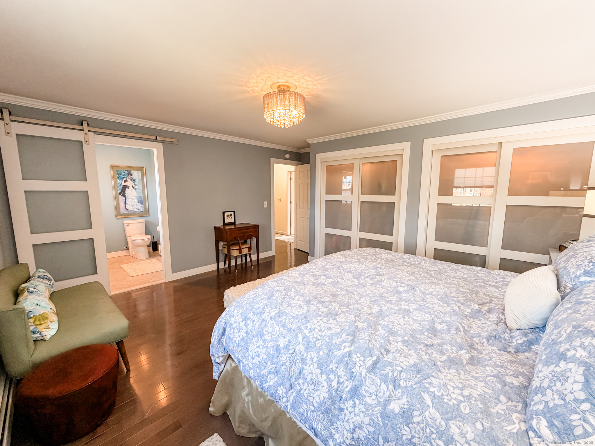 104 Pulpit Rock Road Woodstock, CT 06281 - Photo 17 of 37 a large bedroom with wooden floor and furniture