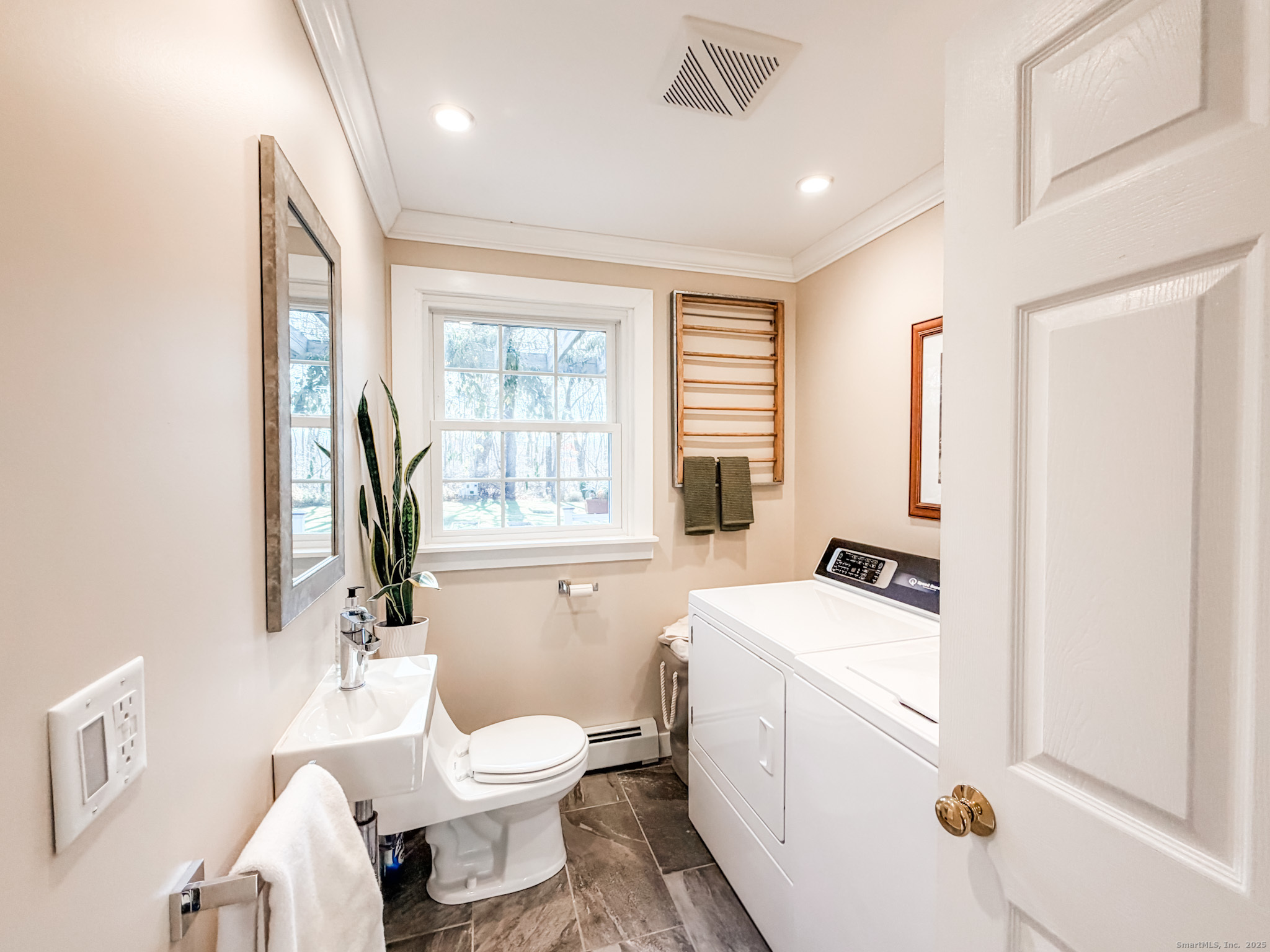 104 Pulpit Rock Road Woodstock, CT 06281 - Photo 23 of 37 a bathroom with a toilet sink and mirror