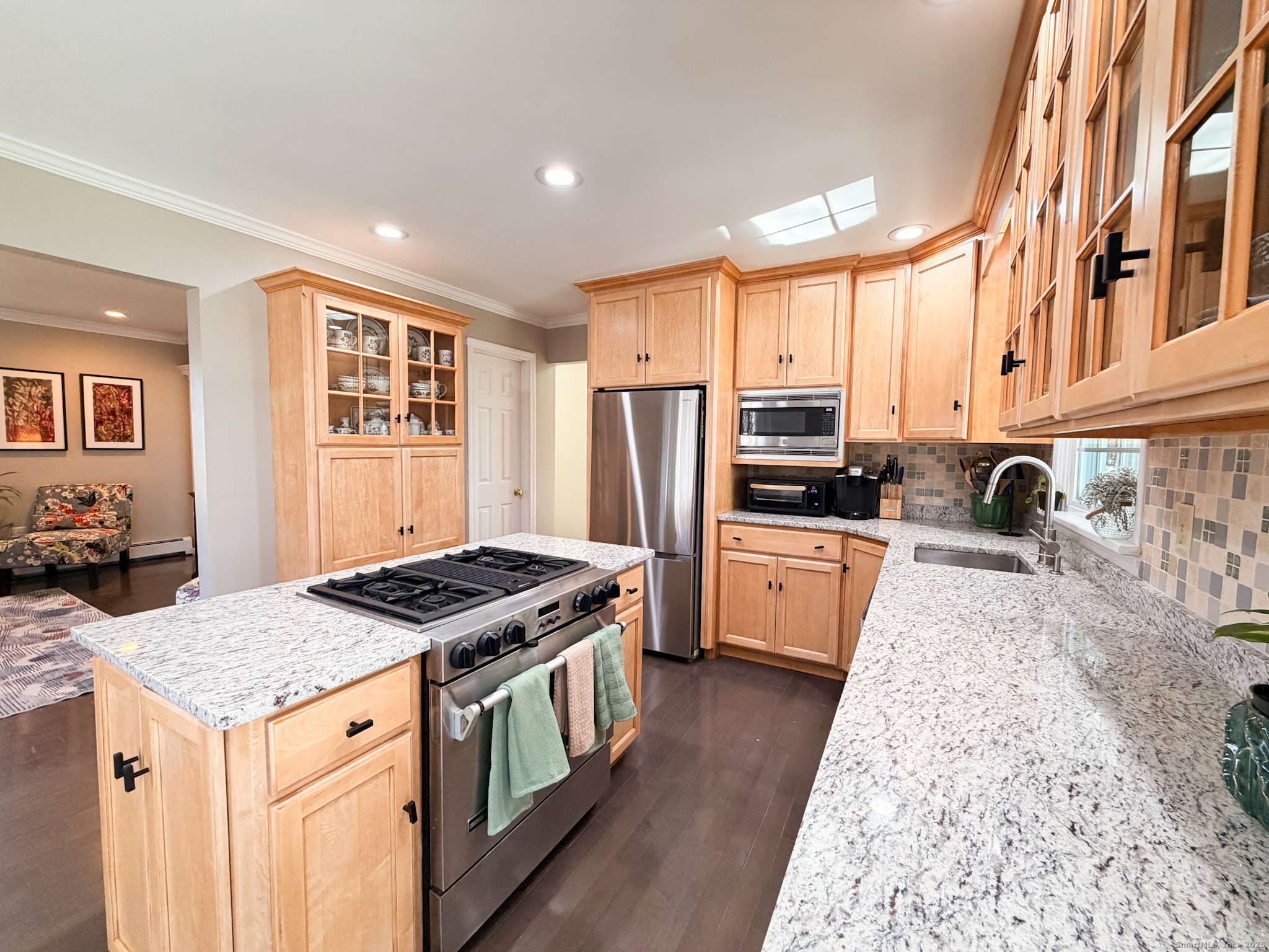104 Pulpit Rock Road Woodstock, CT 06281 - Photo 32 of 37 a kitchen with stainless steel appliances granite countertop a stove a sink dishwasher and a refrigerator