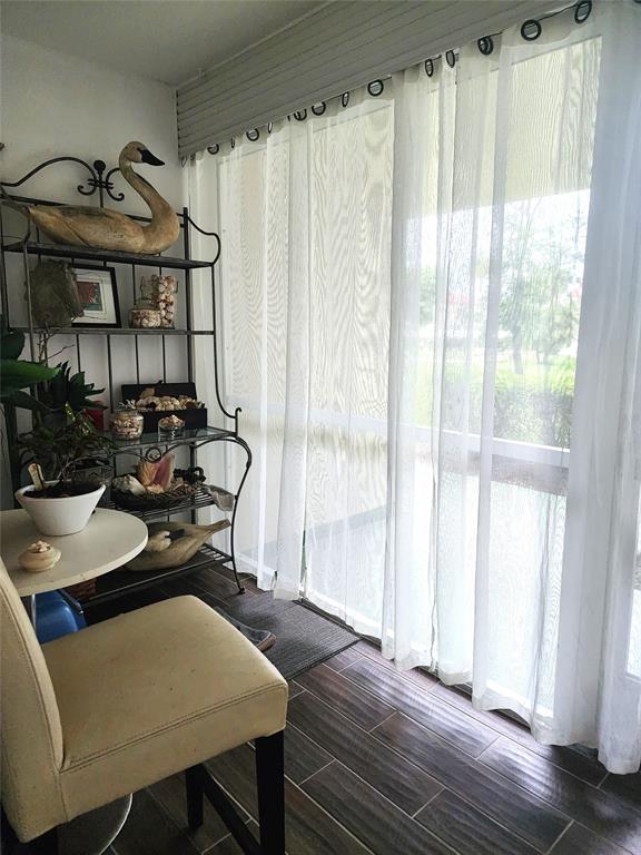 804 Southeast 7th Street, Unit 101 Deerfield Beach, FL 33441 - Photo 11 of 14 a view of a dining room with furniture and window