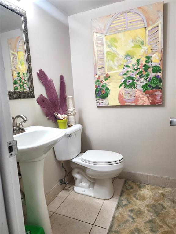 804 Southeast 7th Street, Unit 101 Deerfield Beach, FL 33441 - Photo 8 of 14 a bathroom with a sink and a mirror