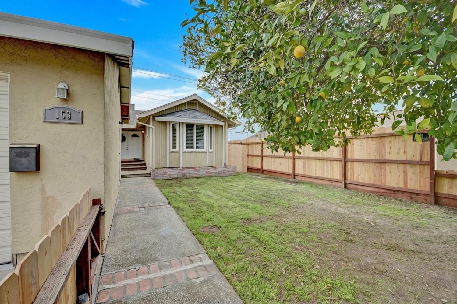 153 Stockton Street Manteca, CA 95337 - Photo 1 of 1 a view of a house with a yard