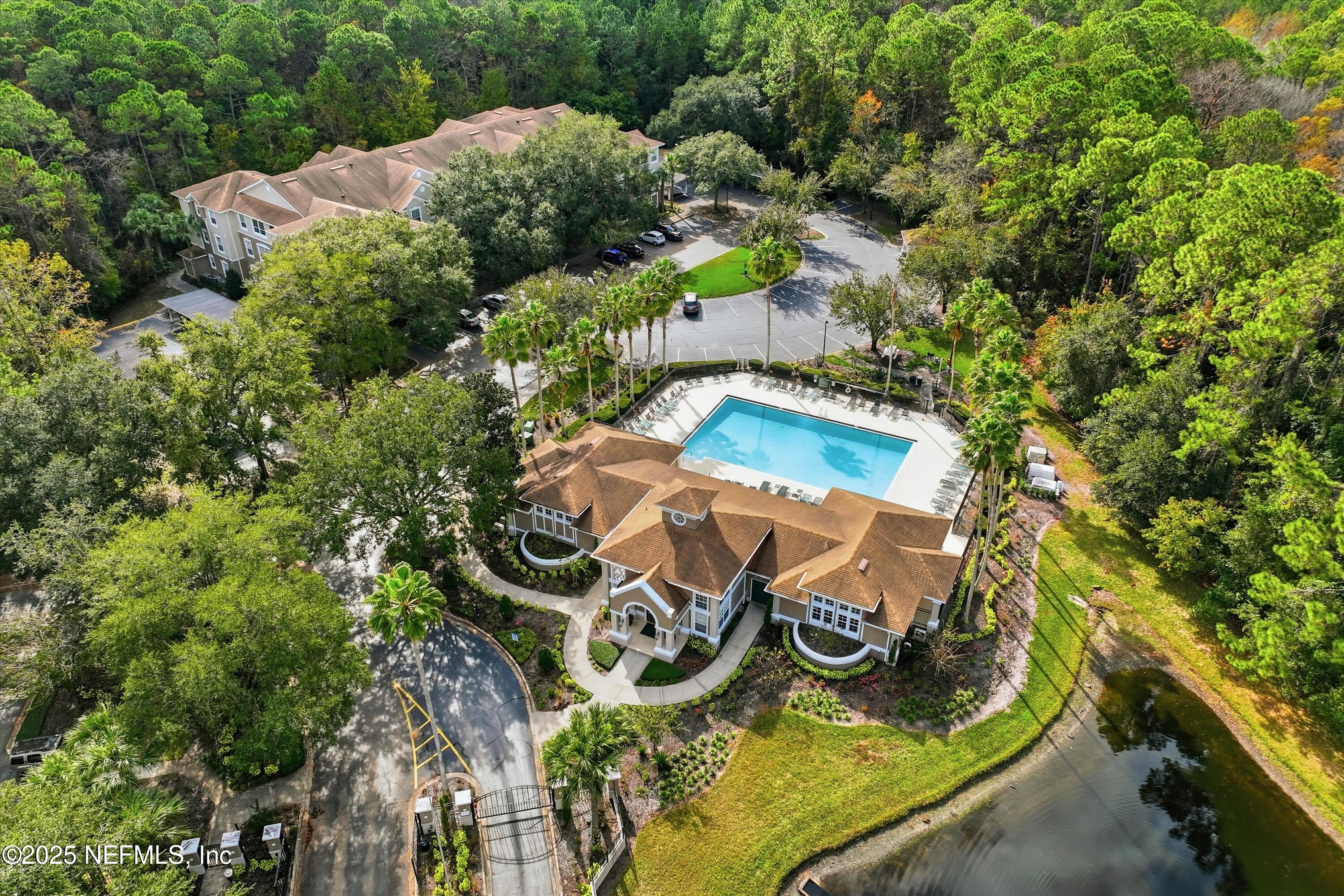 an aerial view of a house with a swimming pool