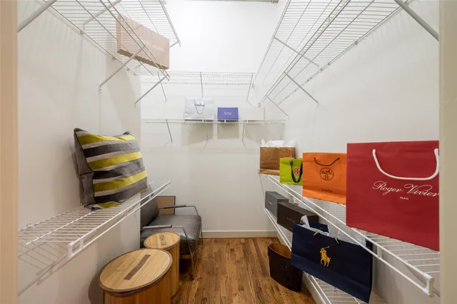 a bathroom with a granite countertop sink a mirror a vanity and a shower