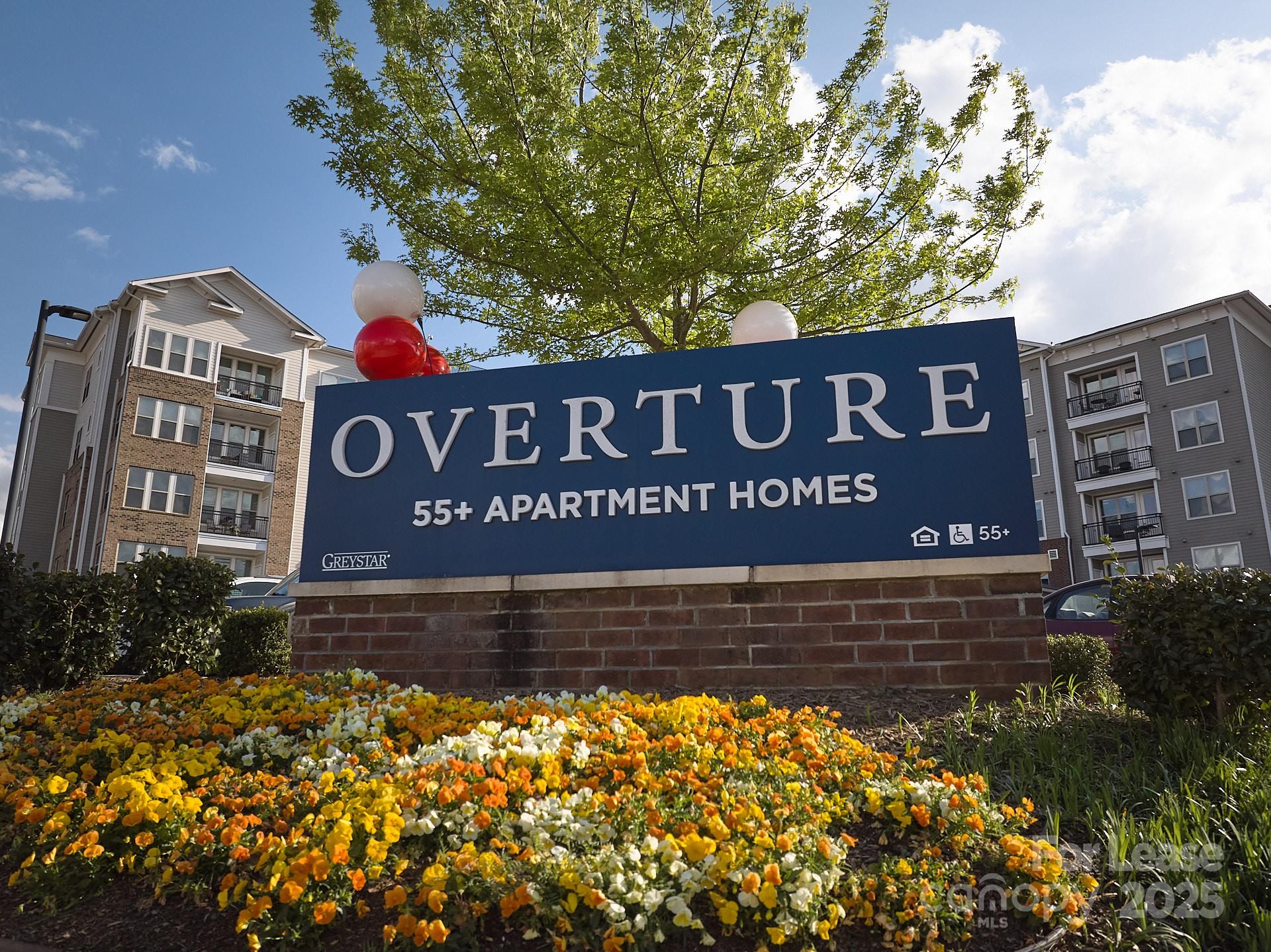6805 Walnut Branch Lane, Unit 222 Charlotte, NC 28277 - Photo 1 of 22 a view of outdoor space with signage and flags