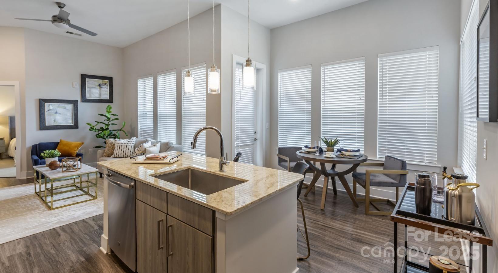 6805 Walnut Branch Lane, Unit 222 Charlotte, NC 28277 - Photo 11 of 22 a view of a a dining room with furniture window and wooden floor