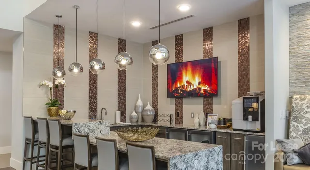 a living room with fireplace furniture and a flat screen tv