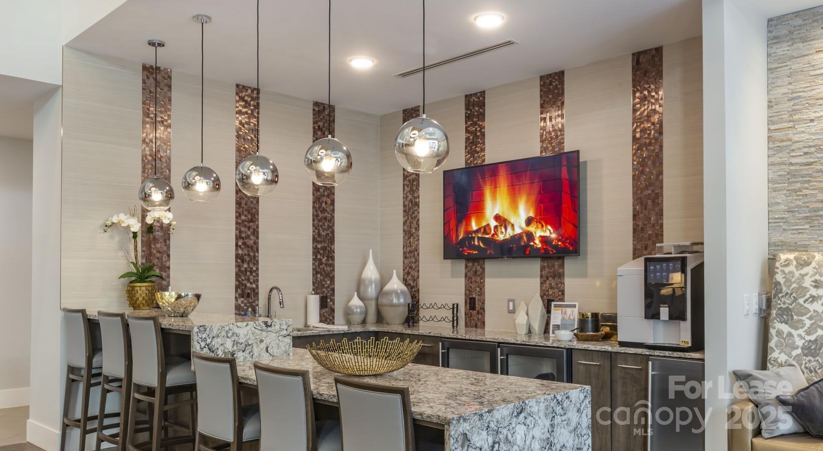 6805 Walnut Branch Lane, Unit 222 Charlotte, NC 28277 - Photo 4 of 22 a living room with fireplace furniture and a flat screen tv