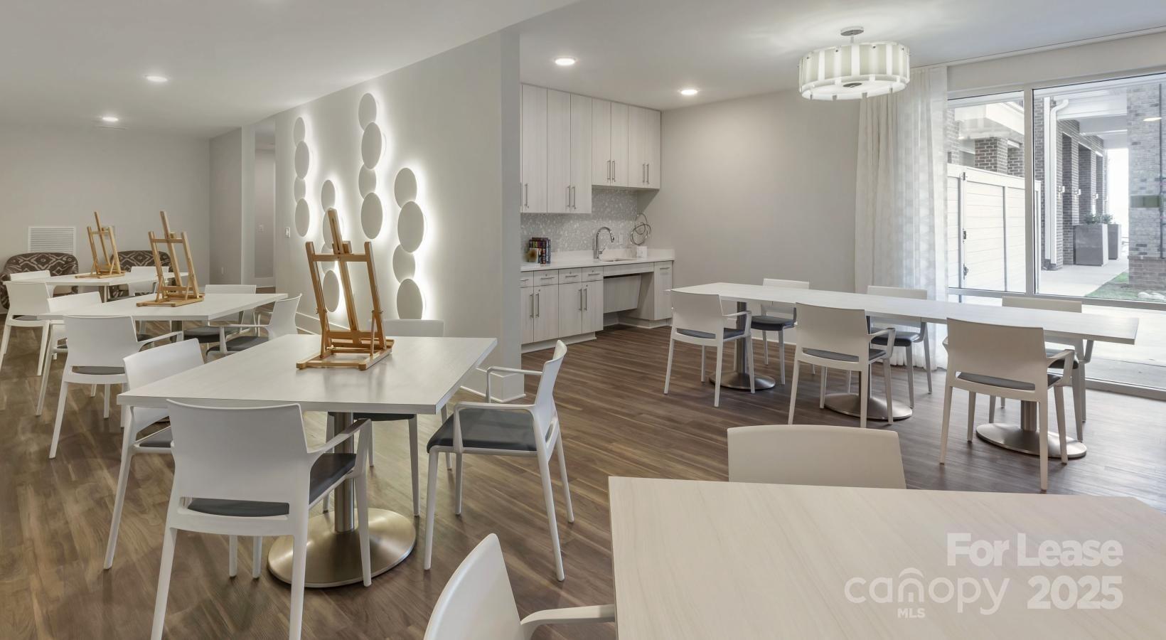 6805 Walnut Branch Lane, Unit 222 Charlotte, NC 28277 - Photo 7 of 22 a living room with stainless steel appliances kitchen island granite countertop furniture and a dining table