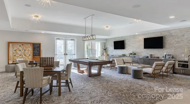 a view of a livingroom with furniture and a flat screen tv