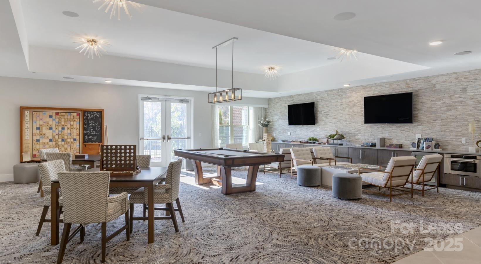 6805 Walnut Branch Lane, Unit 222 Charlotte, NC 28277 - Photo 8 of 22 a view of a livingroom with furniture and a flat screen tv