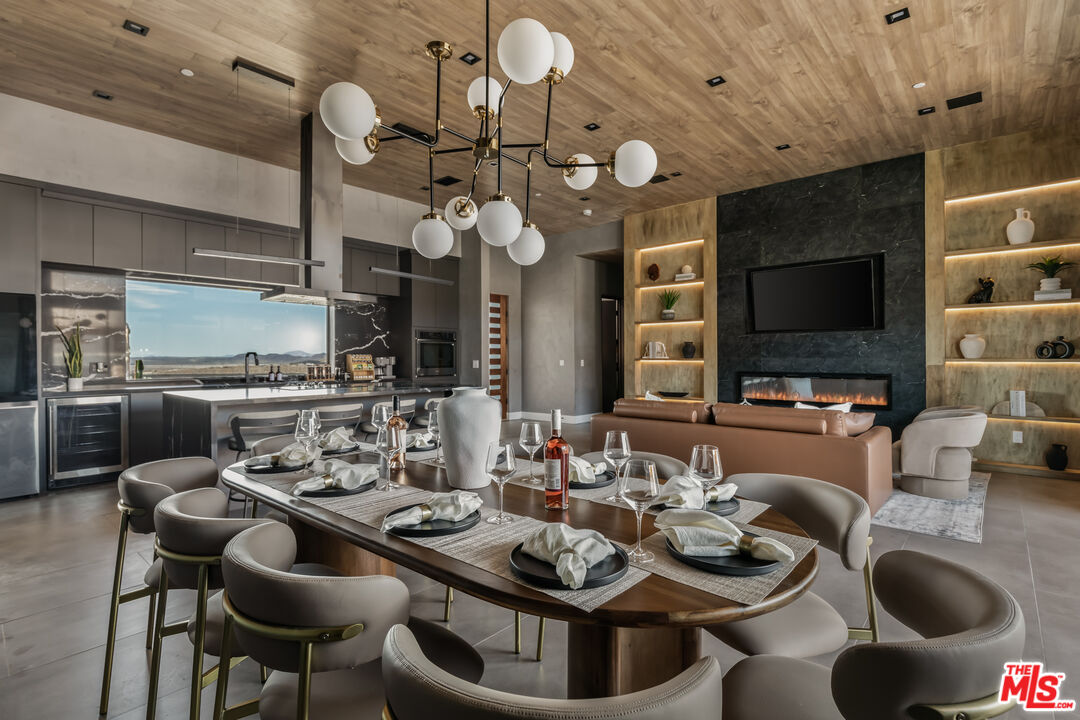 6765 Swanson Road Joshua Tree, CA 92252 - Photo 13 of 69 a kitchen with a dining table and chairs