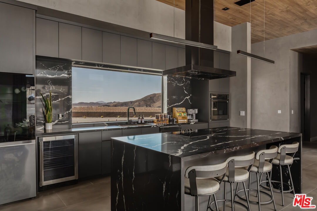 6765 Swanson Road Joshua Tree, CA 92252 - Photo 15 of 69 a kitchen with a sink and cabinets