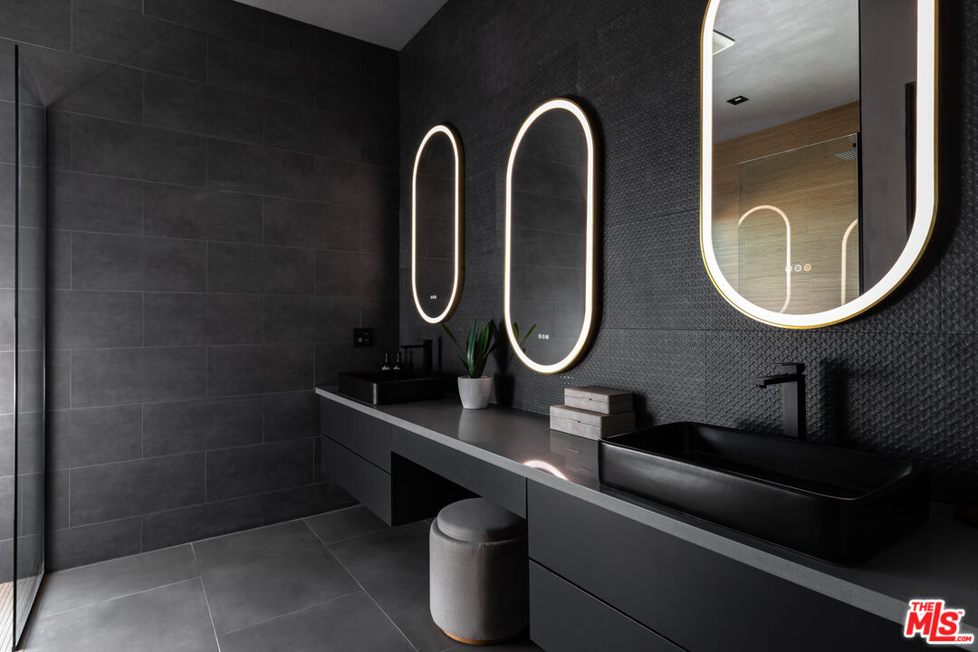 6765 Swanson Road Joshua Tree, CA 92252 - Photo 20 of 69 a close view of light fixtures and a mirror on th wall