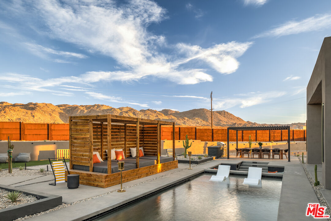 6765 Swanson Road Joshua Tree, CA 92252 - Photo 44 of 69 a view of swimming pool with outdoor seating