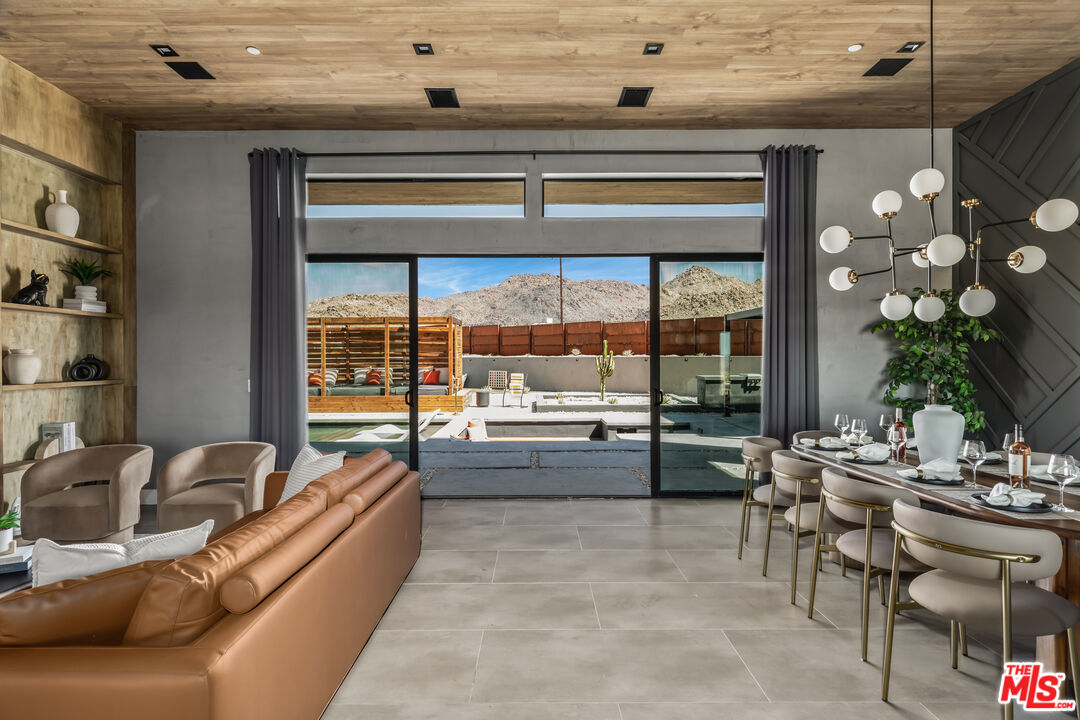 6765 Swanson Road Joshua Tree, CA 92252 - Photo 5 of 69 a living room with furniture and a large window