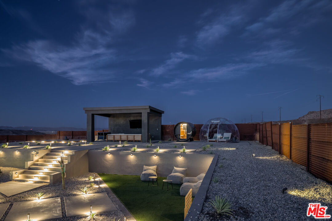 6765 Swanson Road Joshua Tree, CA 92252 - Photo 62 of 69 a view of a swimming pool with seating area